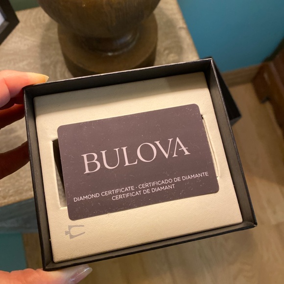 Bulova women’s watch, stainless with diamond bezel